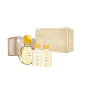Goldea Bvlgari, mostrando la botella redonda y dorada del perfume y sus complementos.