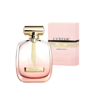 Frasco de cristal degradado en tonos rosa y dorado con una cadena dorada del perfume L’Extase Caresse de Roses.