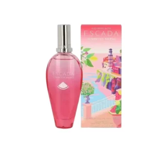 Frasco de Sorbetto Rosso Escaping With Escada rodeado de sandía, evocando frescura y libertad solar.