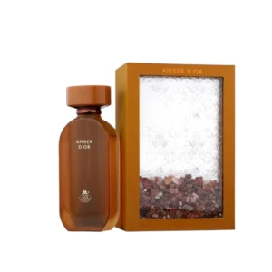 Elegante frasco de Amber D'or French Avenue con detalles dorados que reflejan su esencia lujosa.