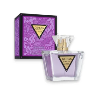 Frasco de cristal transparente del perfume Seductive Charm EDT con detalles en tonos rosados suaves.