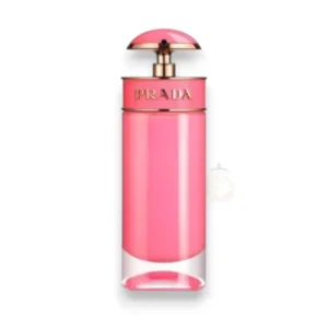 Frasco cilíndrico de color rosa brillante con detalles dorados y un atomizador semiesférico que refleja un diseño moderno y juvenil.