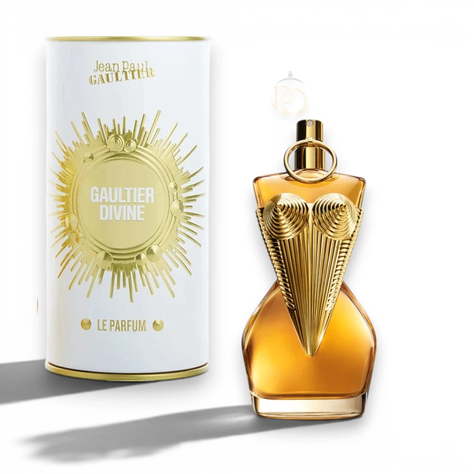 Frasco de Divine Le Parfum con su icónico corsé bañado en un oro intenso y brillante.