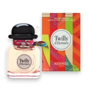 Frasco de Twilly d’Hermes EDP con su icónico sombrero negro y lazo de seda de colores en primer plano.