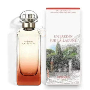 Elegante frasco de Un Jardin Sur La Lagune EDT Mujer con su degradé ocre en un entorno botánico.