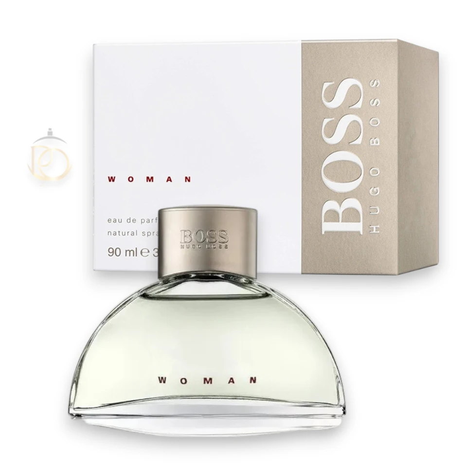 Frasco minimalista de Boss Woman EDP sobre un fondo claro con suaves sombras y destellos de luz.