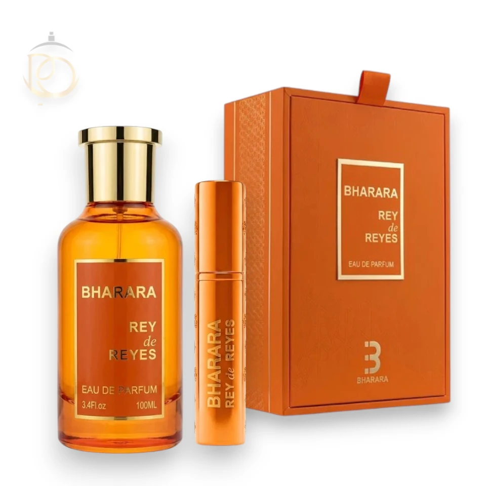 Elegante frasco de perfume Rey De Reyes Orange EDP sobre un fondo luminoso de tonos cálidos.